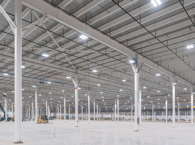High-bay industrial lighting installation in warehouse section